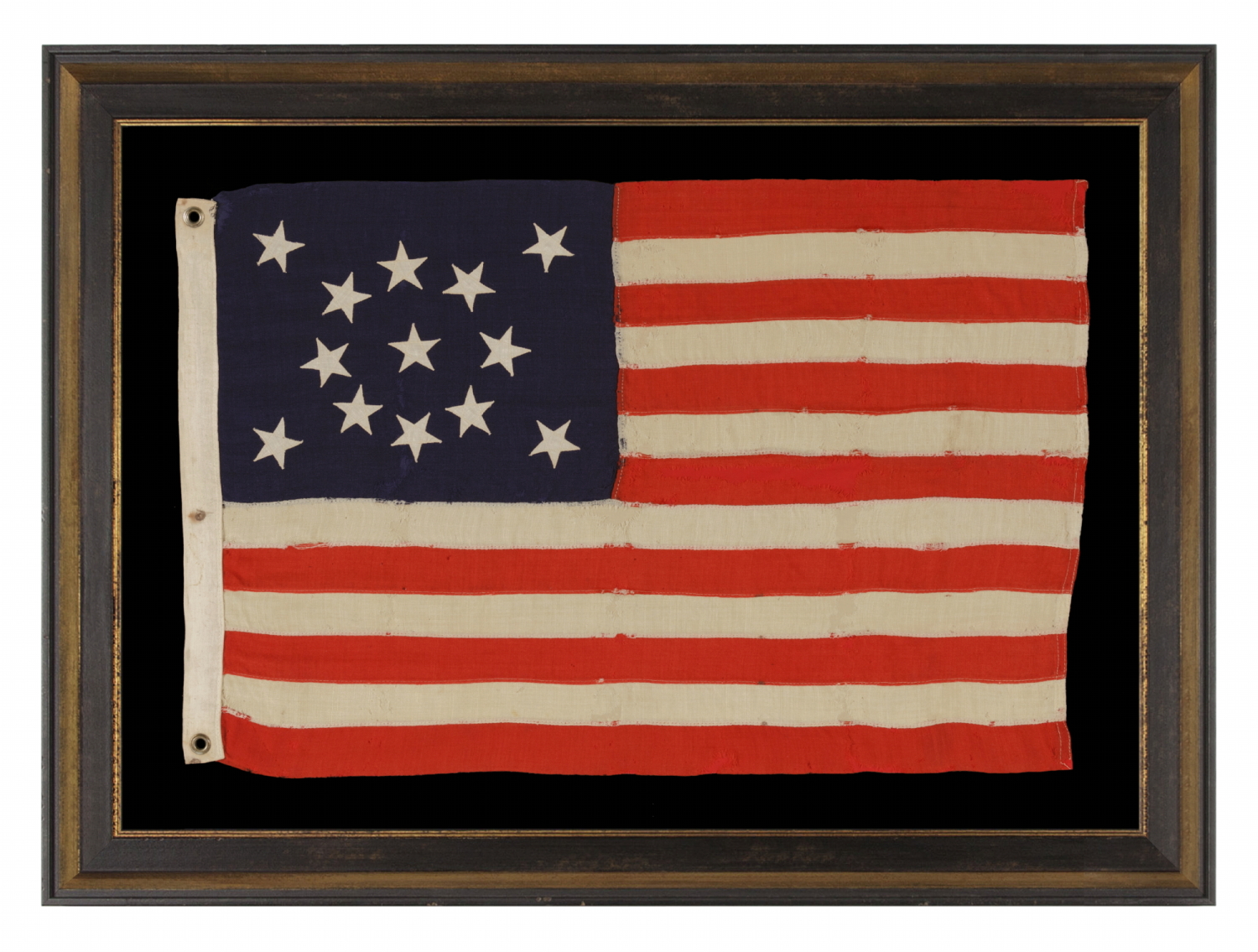 13 STAR ANTIQUE AMERICAN FLAG WITH A MEDALLION CONFIGURATION OF STARS; A SMALL-SCALE EXAMPLE, MADE circa 1895-1926