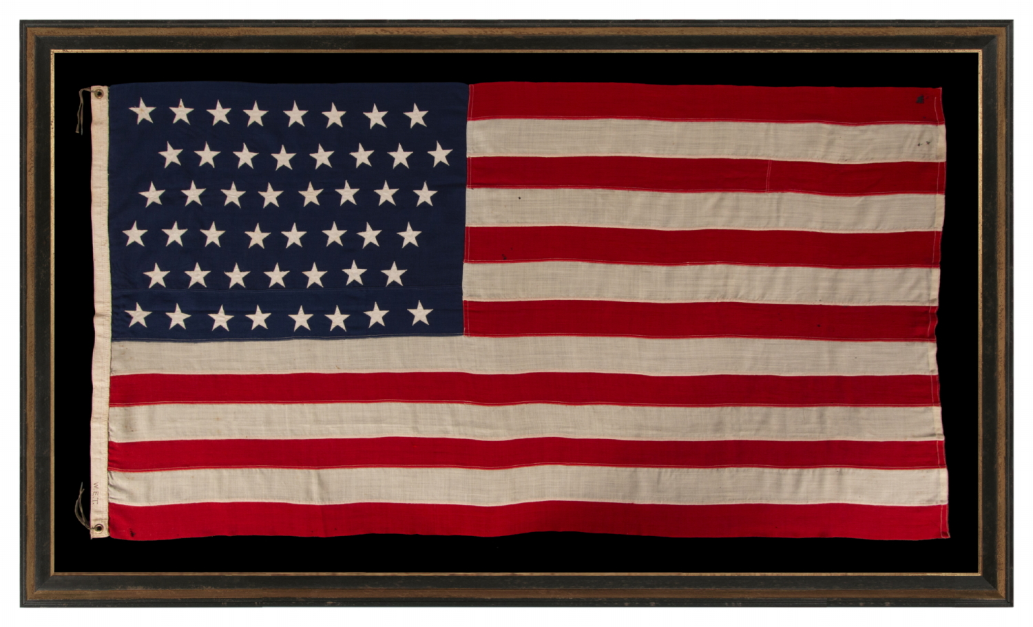 47 STAR ANTIQUE AMERICAN FLAG WITH ZIGZAGGING ROWS, AN EXTREMELY SCARCE EXAMPLE, IN AN UNUSUALLY MANAGEABLE SIZE AMONG ITS KNOWN COUTERPARTS; AN UNOFFICIAL STAR COUNT, 1912, NEW MEXICO STATEHOOD