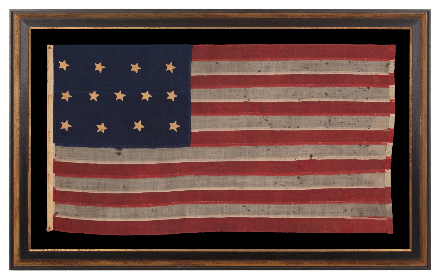 U.S. NAVY SMALL BOAT ENSIGN WITH 13 STARS IN THE 4-5-4 PATTERN, A VERY EARLY EXAMPLE, MADE circa 1835-1850’s, ENTIRELY HAND-SEWN AND IN A TINY SCALE AMONG ITS COUNTERPARTS