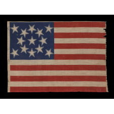 13 HALOED STARS IN A MEDALLION CONFIGURATION, ON AN EXCEPTIONALLY RARE ANTIQUE AMERICAN FLAG MADE FOR THE 1876 CENTENNIAL OF AMERICAN INDEPENDENCE