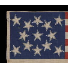 13 HALOED STARS IN A MEDALLION CONFIGURATION, ON AN EXCEPTIONALLY RARE ANTIQUE AMERICAN FLAG MADE FOR THE 1876 CENTENNIAL OF AMERICAN INDEPENDENCE