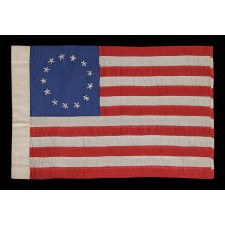 13 HAND-EMBROIDERED STARS AND EXPERTLY HAND-SEWN STRIPES ON AN ANTIQUE AMERICAN FLAG MADE IN PHILADELPHIA IN BY RACHEL ALBRIGHT, GRANDDAUGHTER OF BETSY ROSS, SIGNED AND DATED 1903