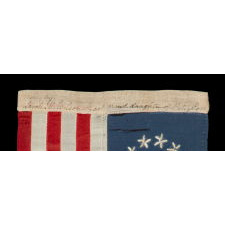 13 HAND-EMBROIDERED STARS AND EXPERTLY HAND-SEWN STRIPES ON AN ANTIQUE AMERICAN FLAG MADE IN PHILADELPHIA BY SARAH M. WILSON, GREAT-GRANDDAUGHTER OF BETSY ROSS, SIGNED & DATED 1908