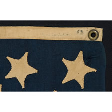 13 HAND-SEWN, SINGLE-APPLIQUED  STARS, MADE BY ANNIN & CO. IN NEW YORK CITY, A RARE, TINY SIZE AMONG KNOWN FLAGS WITH SEWN CONSTRUCTION, 1863 -1876