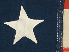 13 HAND-SEWN STARS IN A 3-2-3-2-3 CONFIGURATION, CA 1864-1876, PROBABLY MADE FOR THE CENTENNIAL OF AMERICAN INDEPENDENCE