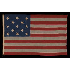 13 HAND-SEWN STARS IN A 3-2-3-2-3 PATTERN ON AN ANTIQUE AMERICAN FLAG OF THE 1876 CENTENNIAL ERA, POSSIBLY A U.S. NAVY SMALL BOAT ENSIGN