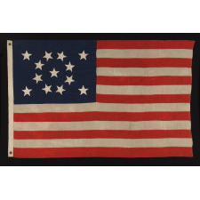 13 HAND-SEWN STARS IN A BEAUTIFUL MEDALLION CONFIGURATION ON A SMALL SCALE ANTIQUE AMERICAN FLAG OF THE 1876 CENTENNIAL ERA