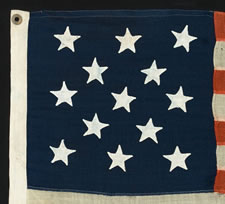 13 HAND-SEWN STARS, 1876 CENTENNIAL ERA, IN A RARE, SMALL, AND HIGHLY DESIRABLE SIZE FOR THE PERIOD