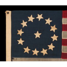 13 HAND-SEWN STARS IN A CIRCULAR VERSION OF THE 3RD MARYLAND PATTERN, MADE DURING THE CIVIL WAR PERIOD OR IMMEDIATELY THEREAFTER, IN A GREAT SMALL SCALE AMONG ITS COUNTERPARTS OF THE PERIOD WITH PIECED-AND-SEWN CONSTRUCTION