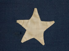 13 HAND-SEWN STARS IN A MEDALLION CONFIGURATION, AN EXTREMELY SCARCE, SMALL SIZE FOR THE PERIOD, 1876 CENTENNIAL ERA