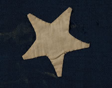 13 HAND-SEWN STARS IN A MEDALLION CONFIGURATION, AN EXTREMELY SCARCE, SMALL SIZE FOR THE PERIOD, 1876 CENTENNIAL ERA