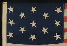 13 HAND-SEWN STARS ON A U.S. NAVY SMALL BOAT ENSIGN OF THE 1876 CENTENNIAL ERA