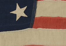 13 HAND-SEWN STARS ON A U.S. NAVY SMALL BOAT ENSIGN OF THE 1876 CENTENNIAL ERA