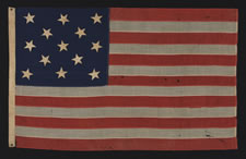 13 HAND-SEWN STARS ON A U.S. NAVY SMALL BOAT ENSIGN OF THE 1876 CENTENNIAL ERA