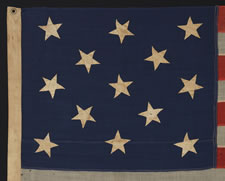 13 HAND-SEWN STARS ON A U.S. NAVY SMALL BOAT ENSIGN OF THE 1876 CENTENNIAL ERA