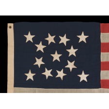 13 STAR ANTIQUE AMERICAN FLAG WITH A BEAUTIFUL MEDALLION CONFIGURATION, A SMALL SCALE EXAMPLE OF THE 1876 CENTENNIAL ERA