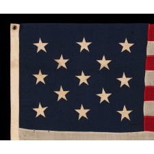 13 STAR ANTIQUE AMERICAN FLAG WITH A 3-2-3-2-3 CONFIGURATION OF STARS; A SMALL-SCALE EXAMPLE, MADE CIRCA 1895-1926