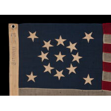 13 STAR ANTIQUE AMERICAN FLAG WITH A BEAUTIFUL MEDALLION CONFIGURATION OF STARS; A SMALL-SCALE EXAMPLE, MADE CIRCA 1895-1926