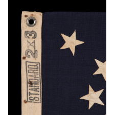 13 STAR ANTIQUE AMERICAN FLAG WITH A MEDALLION CONFIGURATION OF STARS; A SMALL-SCALE EXAMPLE, MADE circa 1895-1926