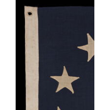 13 STAR ANTIQUE AMERICAN FLAG WITH AN OVAL VERSION OF WHAT IS KNOWN AS THE 3RD MARYLAND PATTERN, MADE IN THE PERIOD BETWEEN THE CIVIL WAR (1861-65) AND THE 1876 CENTENNIAL OF AMERICAN INDEPENDENCE