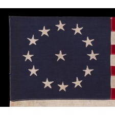 13 STAR ANTIQUE AMERICAN FLAG WITH A CIRCULAR VERSION OF WHAT IS KNOWN AS THE 3RD MARYLAND PATTERN, MADE BETWEEN APPROXIMATELY 1910 AND THE WWII ERA