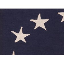 13 STAR ANTIQUE AMERICAN FLAG WITH A CIRCULAR VERSION OF WHAT IS KNOWN AS THE 3RD MARYLAND PATTERN, MADE BETWEEN APPROXIMATELY 1910 AND THE WWII ERA