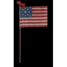 13 STAR ANTIQUE AMERICAN PARADE FLAG WITH A MEDALLION STAR CONFIGURATION, MADE FOR THE 1876 CENTENNIAL CELEBRATION