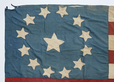 13 STAR FLAG IN THE 3rd MARYLAND PATTERN, AN EXTRAORDINARY EXAMPLE WITH THE STRIPES STARTING AND ENDING ON WHITE AND A CORNFLOWER BLUE CANTON RESTING ON THE WAR STRIPE, PRE-CIVIL WAR, CA 1830-60