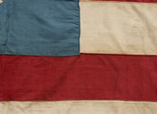 13 STAR FLAG IN THE 3rd MARYLAND PATTERN, AN EXTRAORDINARY EXAMPLE WITH THE STRIPES STARTING AND ENDING ON WHITE AND A CORNFLOWER BLUE CANTON RESTING ON THE WAR STRIPE, PRE-CIVIL WAR, CA 1830-60