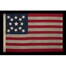 13 STAR FLAG WITH A BEAUTIFUL MEDALLION CONFIGURATION OF STARS; A SMALL-SCALE EXAMPLE, MADE CIRCA 1890-1895