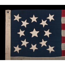 13 STAR FLAG WITH A BEAUTIFUL MEDALLION CONFIGURATION OF STARS; A SMALL-SCALE EXAMPLE, MADE CIRCA 1890-1895