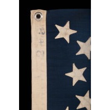 13 STAR FLAG WITH A BEAUTIFUL MEDALLION CONFIGURATION OF STARS; A SMALL-SCALE EXAMPLE, MADE CIRCA 1890-1895