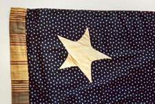 13 STAR FLAG WITH A CALICO CANTON RESTING ON THE WAR STRIPE, 1876 CENTENNIAL