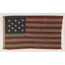 13 STAR FLAG WITH HAND-SEWN, CANTED STARS IN A 3-2-3-2-3 PATTERN, THE ONLY EXAMPLE I HAVE EVER ENCOUNTERED WITH THE MARK OF THE “UNITED STATES LIGHTHOUSE ESTABLISHMENT”, AN EXCEPTIONAL EXAMPLE IN A WONDERFUL SMALL SCALE, MADE ca 1880 - 1895