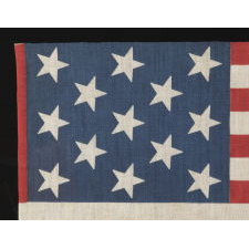 13 STAR PARADE FLAG IN A 3-2-3-2-3 PATTERN, MADE CA 1876-1898, UNUSUALLY LARGE AND WITH AN UNUSUAL STAR PATTERN AMONG ITS COUNTERPARTS OF THE 19TH CENTURY