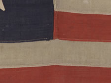 13 STAR PRIVATE YACHT FLAG, A SCARCE AND DESIRABLE EXAMPLE WITH SINGLE-APPLIQUED, HAND-SEWN STARS AND ANCHOR, MADE BY ANNIN IN NEW YORK CITY, CA 1865-1890