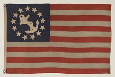 13 STAR PRIVATE YACHT FLAG, A SCARCE AND DESIRABLE EXAMPLE WITH SINGLE-APPLIQUED, HAND-SEWN STARS AND ANCHOR, MADE BY ANNIN IN NEW YORK CITY, CA 1865-1890