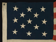 13 STARS IN A 3-2-3-2-3 CONFIGURATION ON A SMALL SCALE FLAG WITH "SQUARISH" PROPORTIONS, 1895-1926