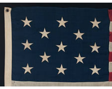 13 STARS IN A 3-2-3-2-3 CONFIGURATION, SMALL SCALE FLAG WITH ELONGATED PROPORTIONS, 1895-1910