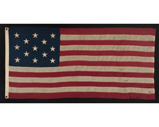 13 STARS IN A 3-2-3-2-3 CONFIGURATION, SMALL SCALE FLAG WITH ELONGATED PROPORTIONS, 1895-1910