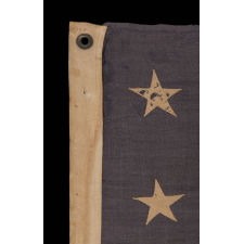 13 STARS IN A 3-2-3-2-3 PATTERN ON A DUSTY BLUE CANTON, ON A SMALL-SCALE, ANTIQUE AMERICAN FLAG WITH AN ELONGATED PROFILE, MADE DURING THE LAST DECADE OF THE 19TH CENTURY, CA 1890-1895