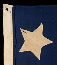 13 STARS IN A 4-5-4 CONFIGURATION, A U.S. NAVY SMALL BOAT ENSIGN, ENTIRELY HAND-SEWN, WITH UNUSUALLY LARGE STARS THAT HAVE AN UNCOMMONLY BOLD PRESENTATION, MADE SOMETIME BETWEEN 1850 AND THE OPENING YEARS OF THE CIVIL WAR (1861-63)