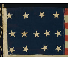 13 STARS IN A 4-5-4 CONFIGURATION, ENTIRELY HAND-SEWN, PROBABLY A U.S. NAVY SMALL BOAT ENSIGN IN A GREAT SIZE, WITH GREAT GRAPHIC QUALITIES, MADE SOMETIME BETWEEN 1850 AND THE OPENING YEARS OF THE CIVIL WAR (1861-1863)