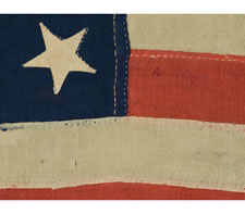 13 STARS IN A 4-5-4 CONFIGURATION, ENTIRELY HAND-SEWN, PROBABLY A U.S. NAVY SMALL BOAT ENSIGN IN A GREAT SIZE, WITH GREAT GRAPHIC QUALITIES, MADE SOMETIME BETWEEN 1850 AND THE OPENING YEARS OF THE CIVIL WAR (1861-1863)