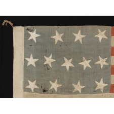 13 STARS IN A 4-5-4 PATTERN, ON A FLAG OF THE CIVIL WAR ERA, WITH BEAUTIFUL COLORATION AND IN A TINY SCALE AMONGST ITS PIECED-AND-SEWN COUNTERPARTS