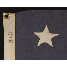 13 STARS ARRANGED IN A 3-2-3-2-3 PATTERN ON A BEAUTIFUL DUSTY BLUE CANTON, ON A SMALL-SCALE ANTIQUE AMERICAN FLAG MADE BETWEEN THE MID-1880'S AND 1890'S