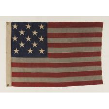 13 STARS ARRANGED IN A 3-2-3-2-3 LINEAL CONFIGURATION ON A SMALL-SCALE ANTIQUE AMERICAN FLAG MADE DURING THE FIRST HALF OF THE 1890's