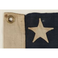 13 STARS ARRANGED IN A 3-2-3-2-3 LINEAL CONFIGURATION ON A SMALL-SCALE ANTIQUE AMERICAN FLAG MADE DURING THE FIRST HALF OF THE 1890's