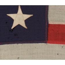 13 STARS ARRANGED IN A 3-2-3-2-3 LINEAL CONFIGURATION ON A SMALL-SCALE ANTIQUE AMERICAN FLAG MADE DURING THE FIRST HALF OF THE 1890's