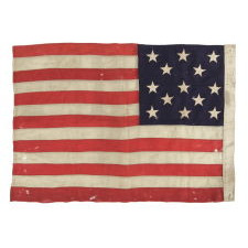 13 STARS ARRANGED IN A 3-2-3-2-3 LINEAL CONFIGURATION ON A SMALL-SCALE ANTIQUE AMERICAN FLAG MADE DURING THE FIRST HALF OF THE 1890's